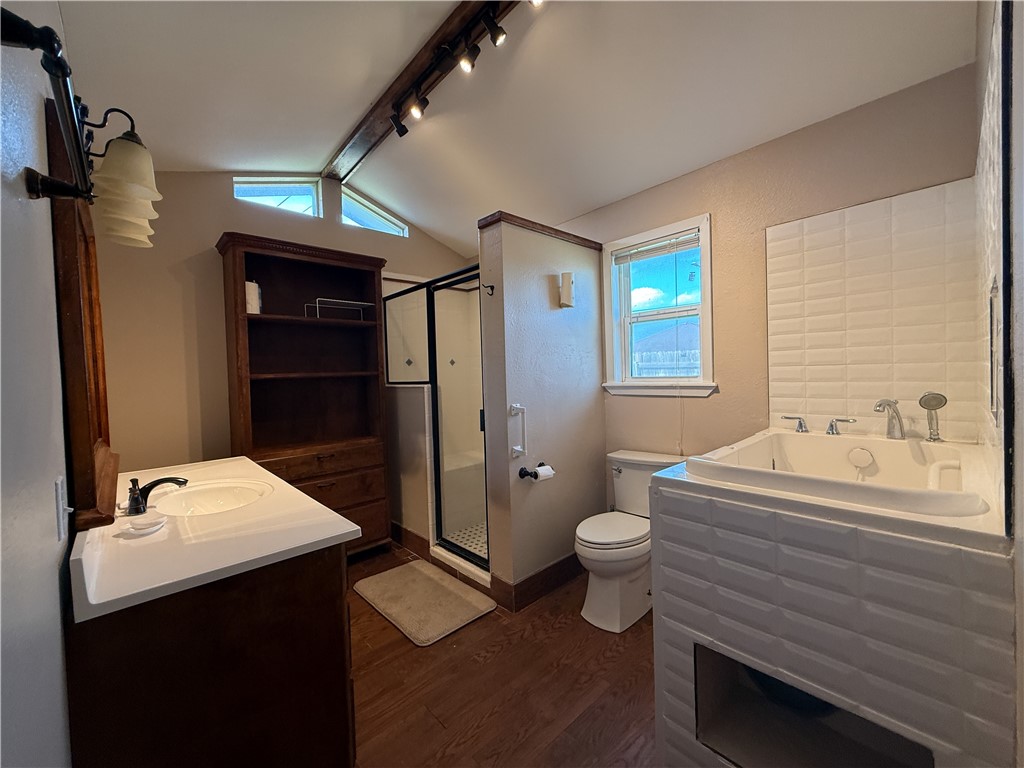 10502 Hemlock Road Corpus Christi, TX 78410 - Photo 25 of 31 a bathroom with a sink toilet and shower