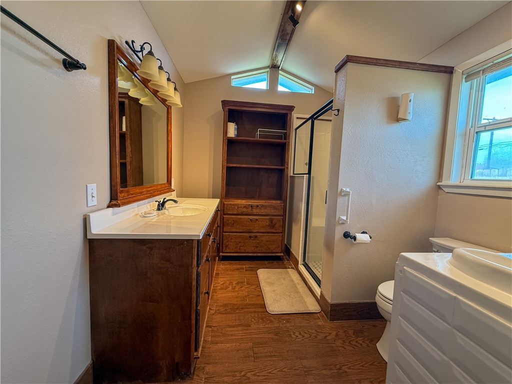 10502 Hemlock Road Corpus Christi, TX 78410 - Photo 26 of 31 a bathroom with a sink a toilet and shower