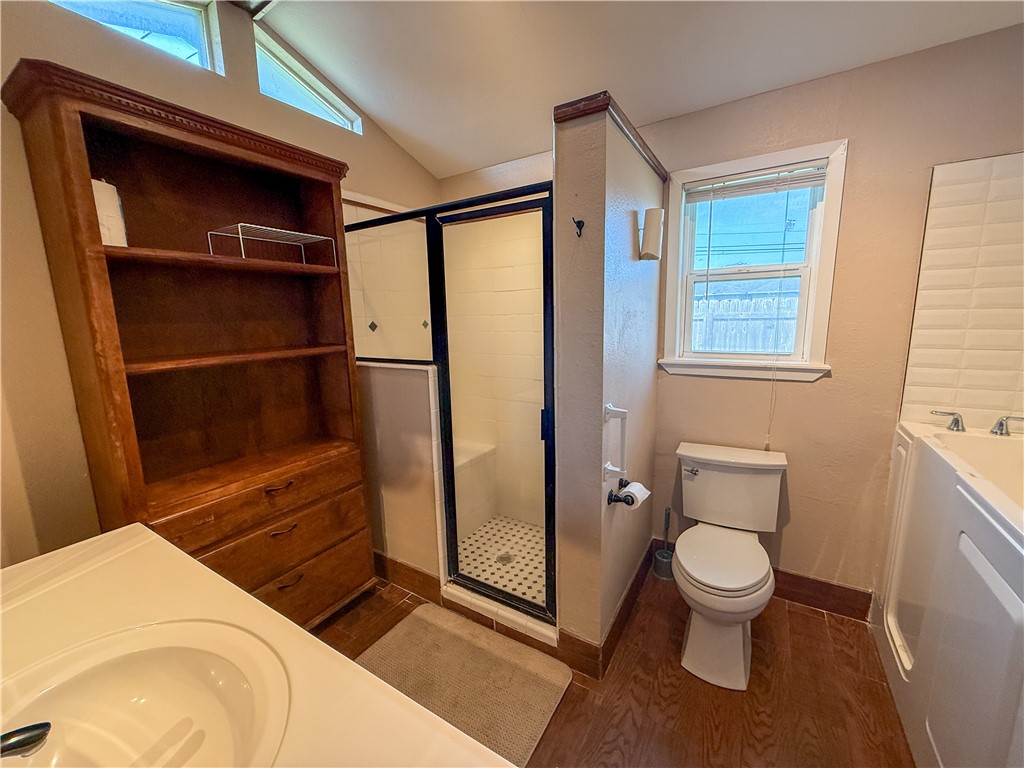 10502 Hemlock Road Corpus Christi, TX 78410 - Photo 27 of 31 a bathroom with a toilet and a shower