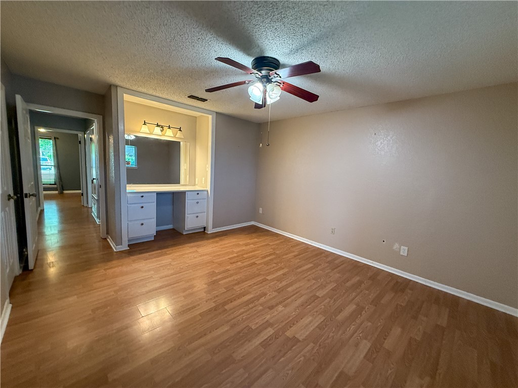 10502 Hemlock Road Corpus Christi, TX 78410 - Photo 28 of 31 wooden floor in an empty room with a window