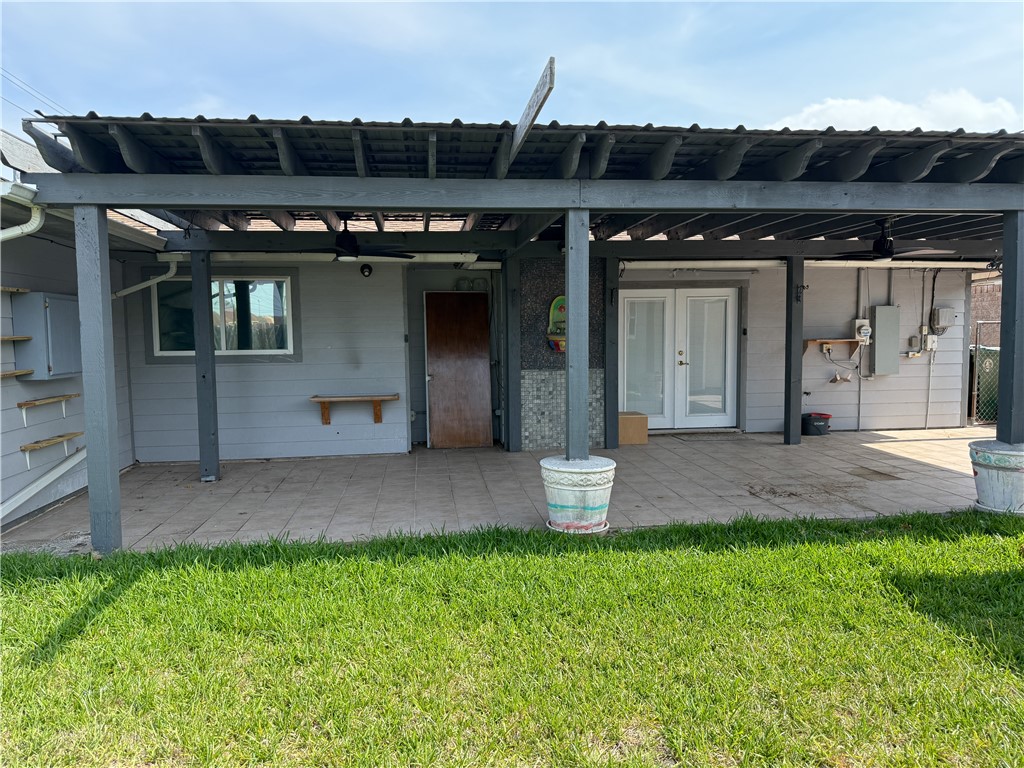 10502 Hemlock Road Corpus Christi, TX 78410 - Photo 29 of 31 a front view of a house with a yard