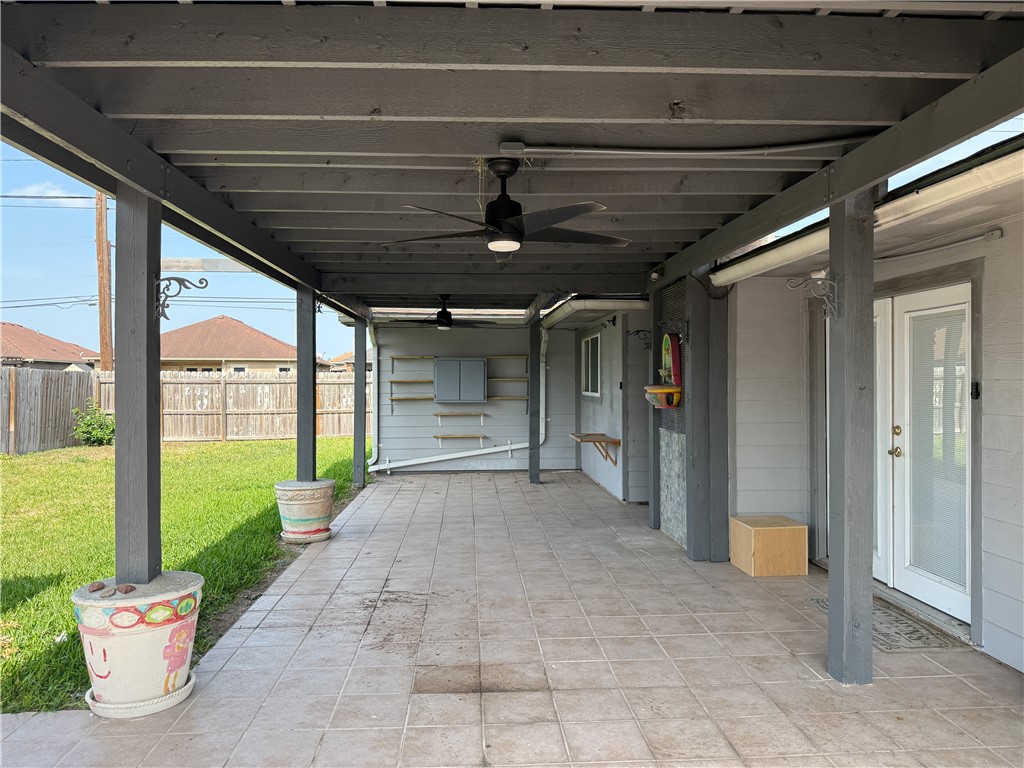 10502 Hemlock Road Corpus Christi, TX 78410 - Photo 31 of 31 a view of a porch with a table and chairs and floor to ceiling window
