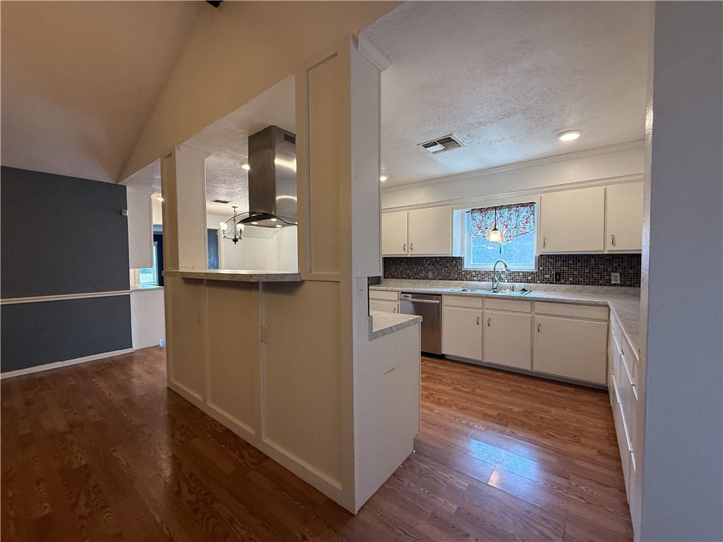 10502 Hemlock Road Corpus Christi, TX 78410 - Photo 10 of 31 a kitchen with a refrigerator and a stove top oven