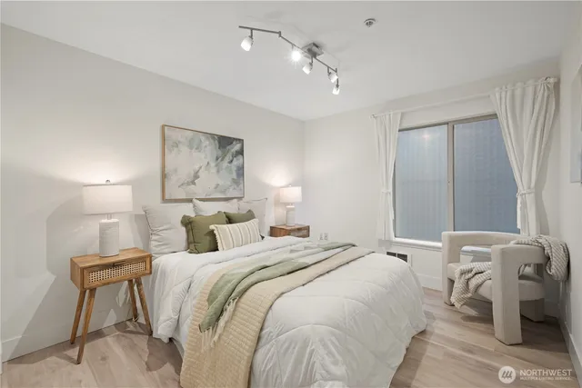 a bedroom with a bed and a table