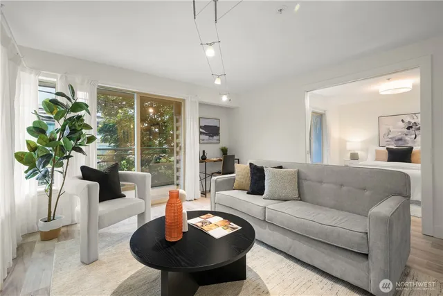 a living room with furniture and a large window