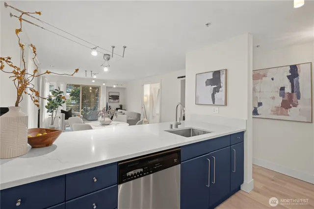 a kitchen with cabinets a sink and white cabinets