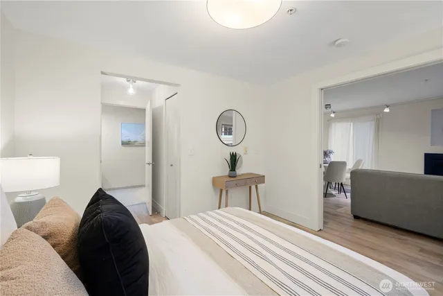 a bedroom with a bed and a couch