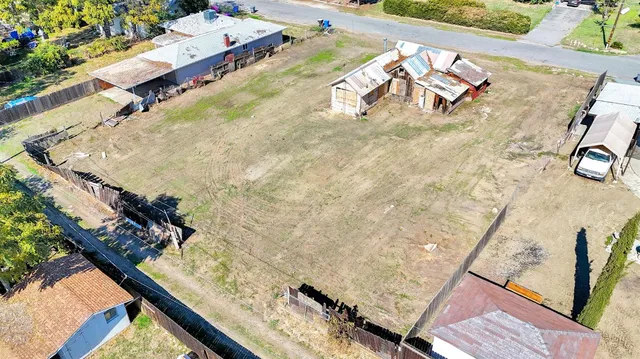 a view of swimming pool with outdoor seating and a garden