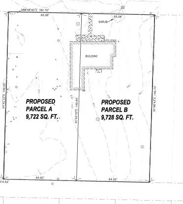 an aerial view of a houses with a swimming pool