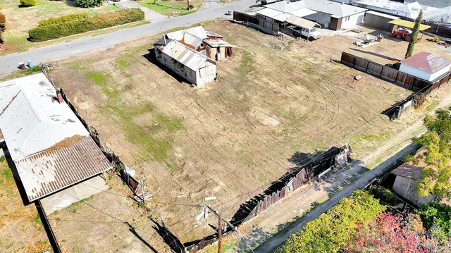 a view of a house with swimming pool and sitting area