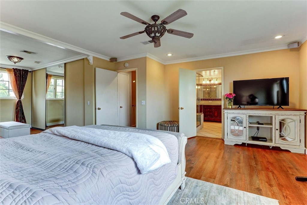 19238 Castlebay Lane Porter Ranch, CA 91326 - Photo 24 of 38 a bedroom with a bed and a flat screen tv