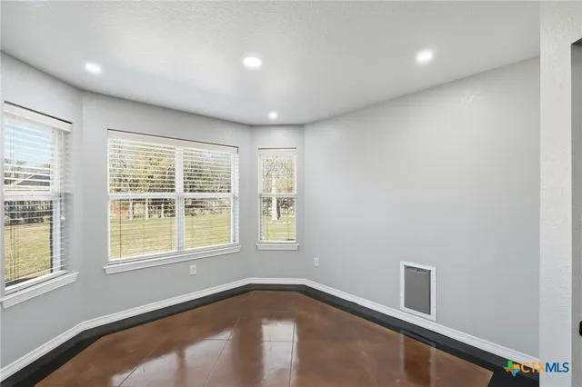 a kitchen with stainless steel appliances granite countertop a refrigerator stove and sink