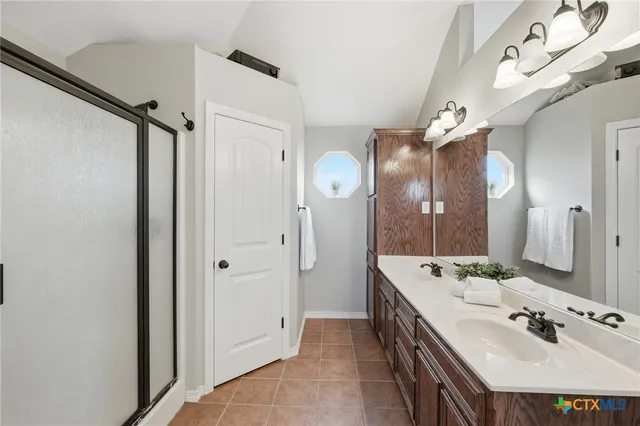 an empty room with window and ceiling fan