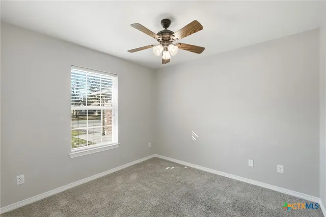 a bathroom with a sink vanity mirror and toilet