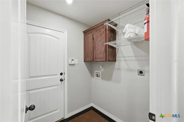 an empty room with a ceiling fan and a window