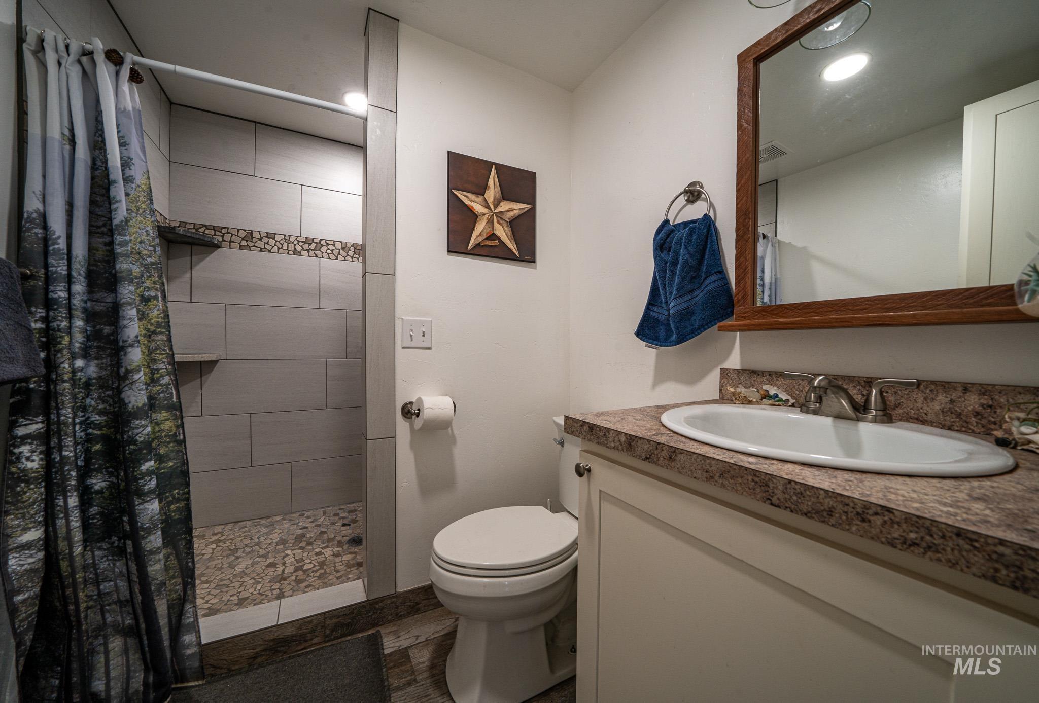 67 Jessup Road Grangeville, ID 83530 - Photo 30 of 49 Walk-in shower with pebble flooring and tiled walls