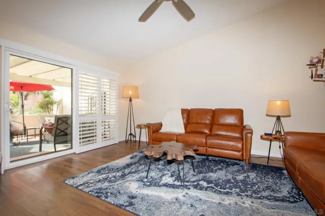 a living room with furniture and a lamp