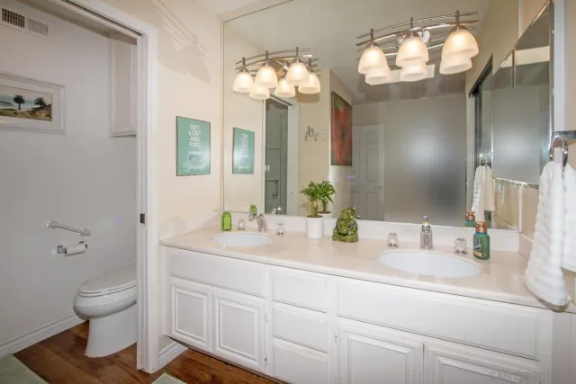 a bathroom with a glass shower door