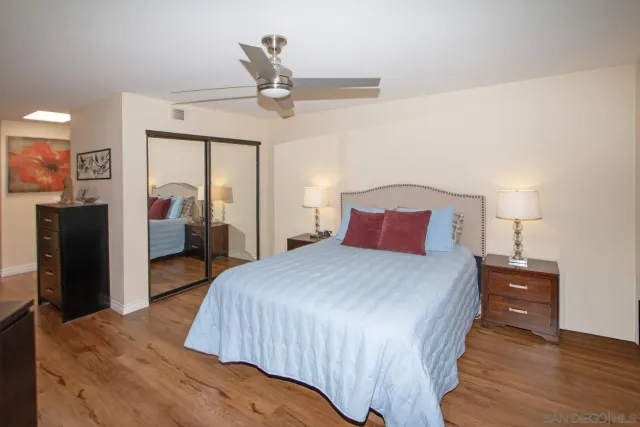 a spacious bathroom with a double vanity sink and a mirror