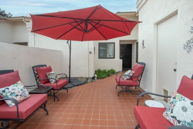 a outdoor space with furniture and umbrella