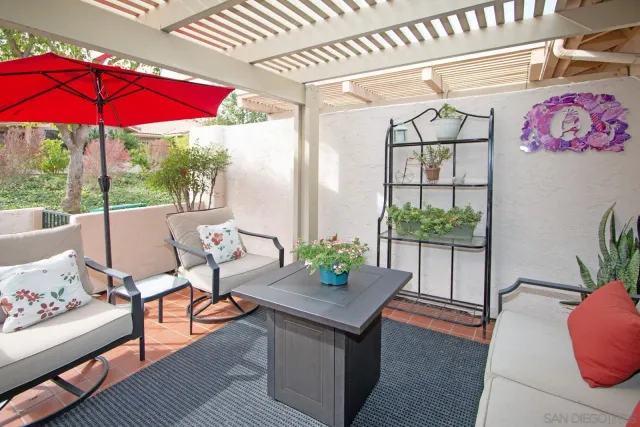 a view of a patio and fire pit