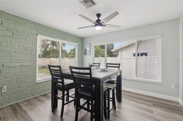 a view of kitchen with cabinets table and chairs