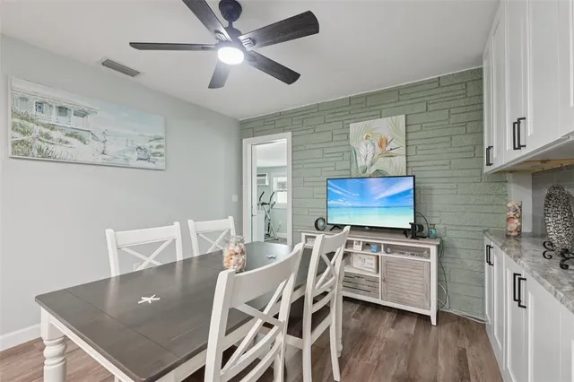 a kitchen with stainless steel appliances granite countertop a refrigerator and a stove