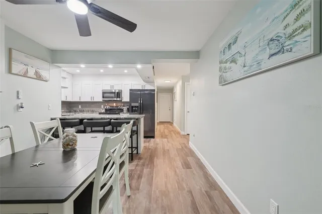 a kitchen with stainless steel appliances granite countertop a stove and a sink