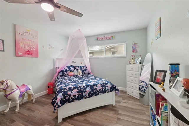 a bathroom with a granite countertop sink vanity and mirror