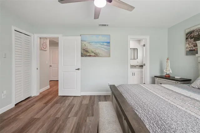 a bathroom with a granite countertop sink mirror and a bathtub