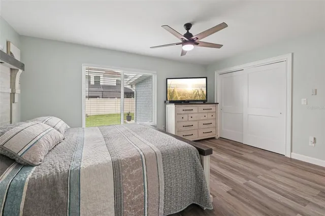 a view of a house with a backyard and sitting area