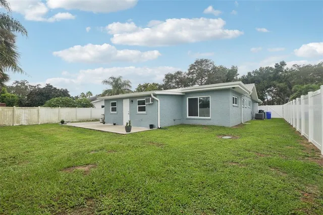an aerial view of residential houses with outdoor space and street view