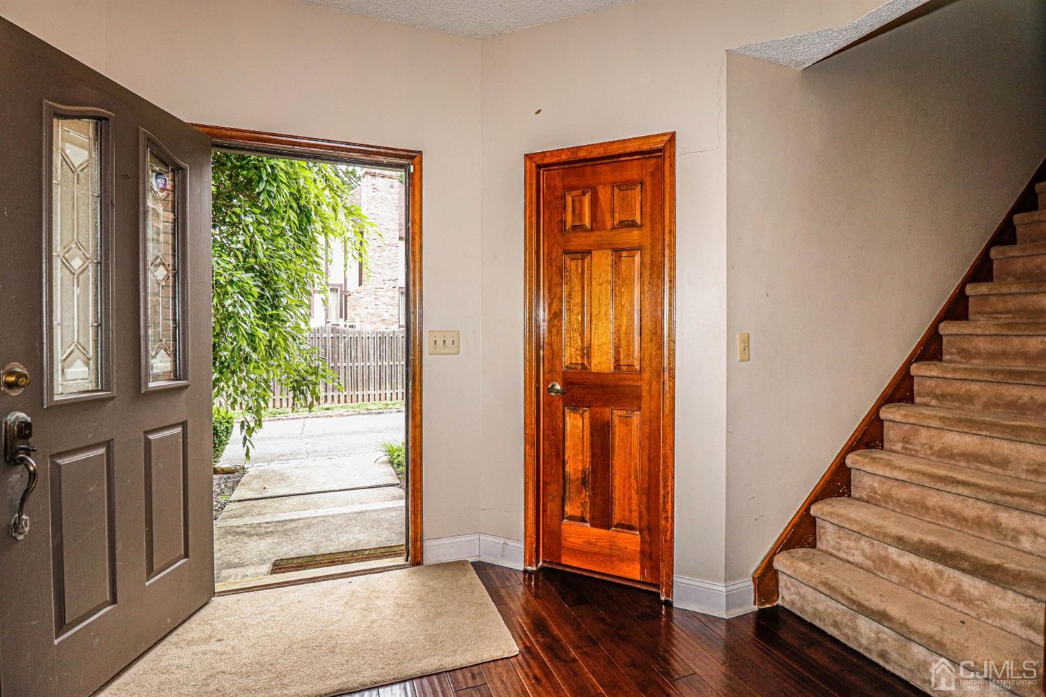15 Skytop Road Edison, NJ 08820 - Photo 2 of 29 a view of front door with wooden floor and stairs