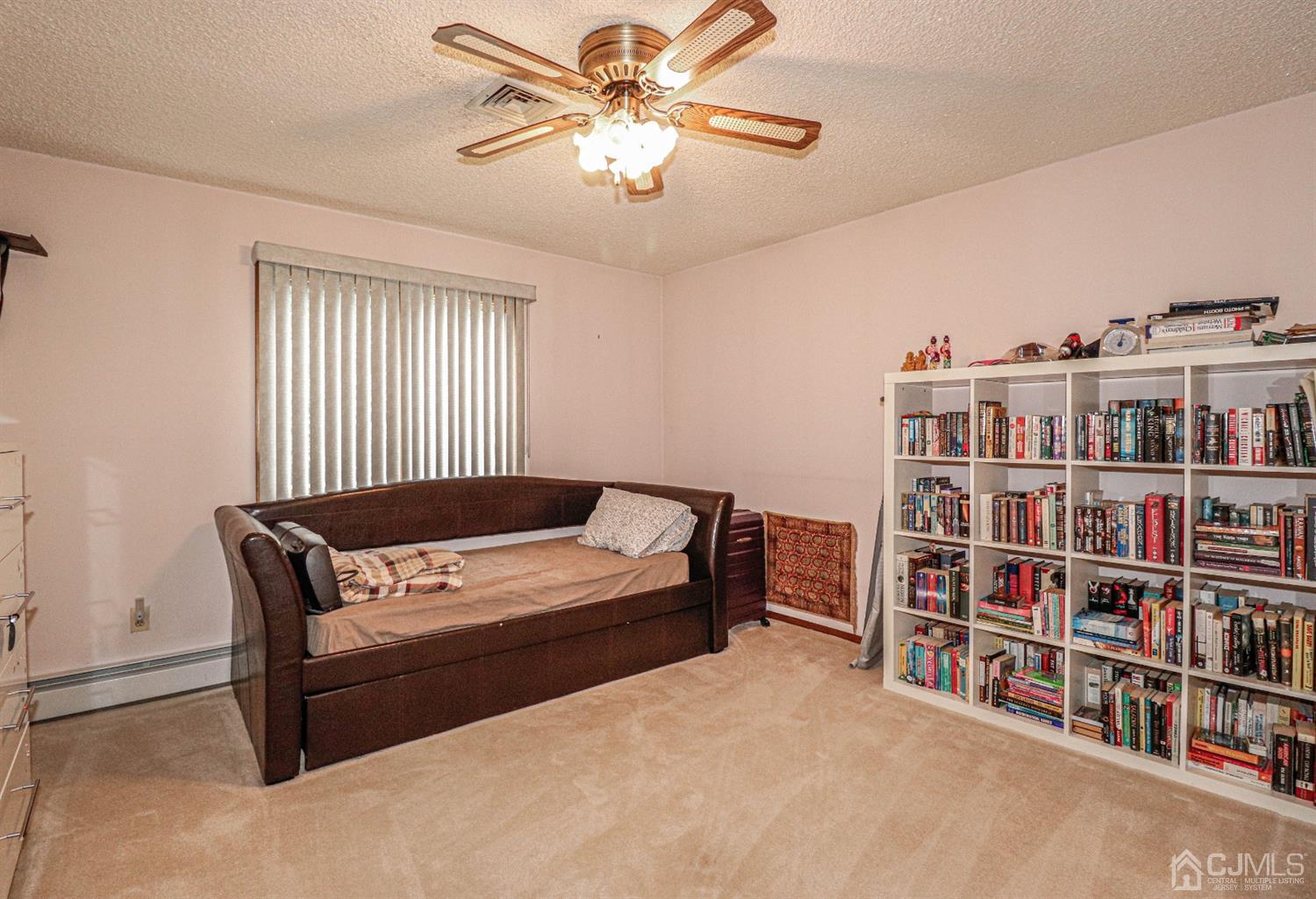 15 Skytop Road Edison, NJ 08820 - Photo 15 of 29 a bedroom with a bed and a book shelf