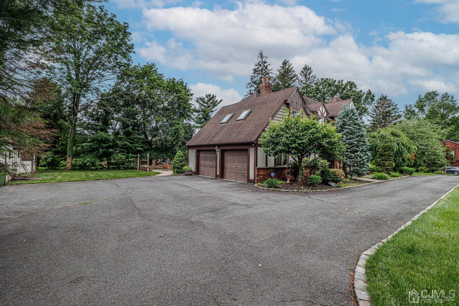 15 Skytop Road Edison, NJ 08820 - Photo 26 of 29 a view of a house with a yard and large trees