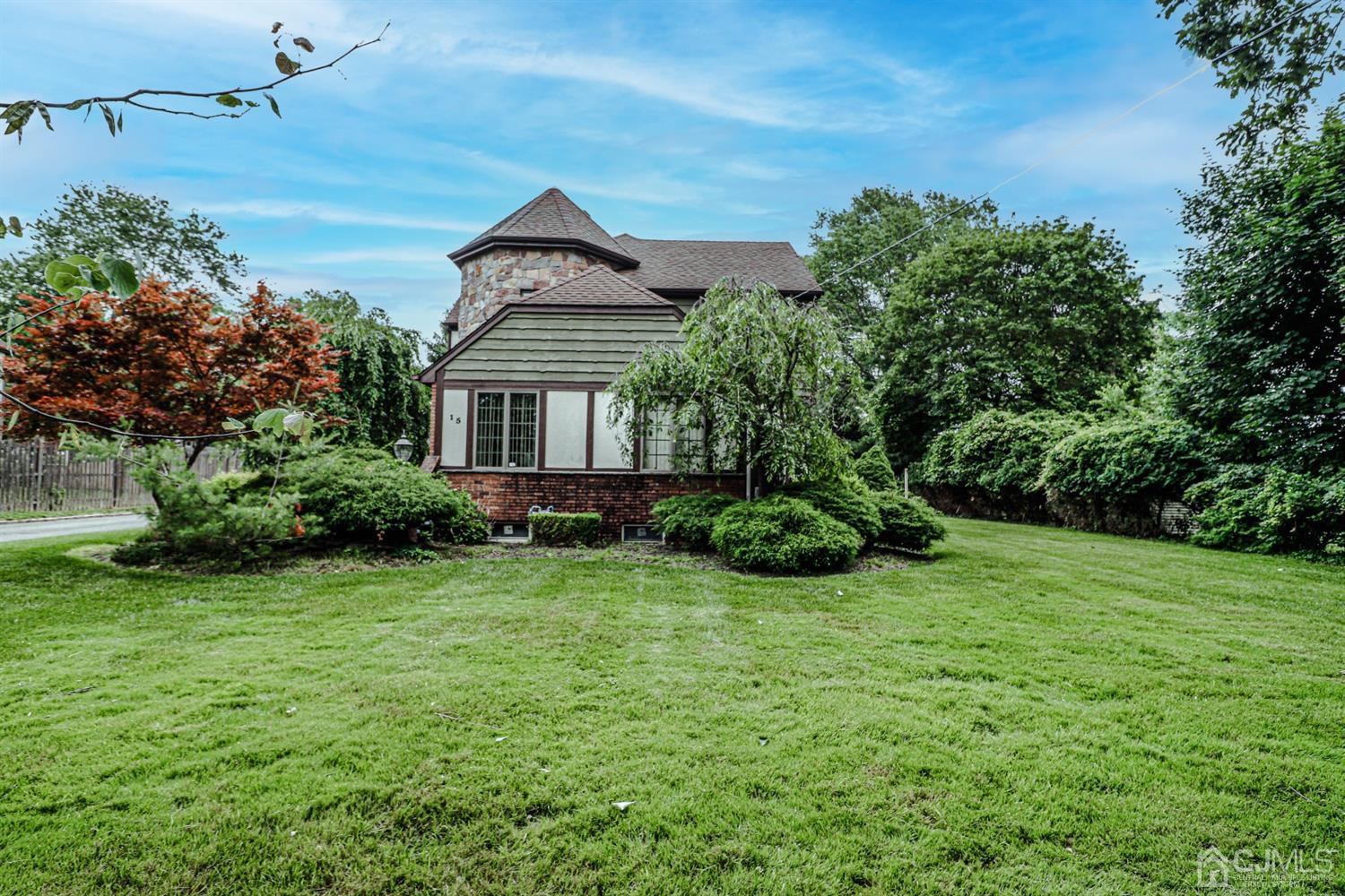 15 Skytop Road Edison, NJ 08820 - Photo 28 of 29 a front view of a house with a yard