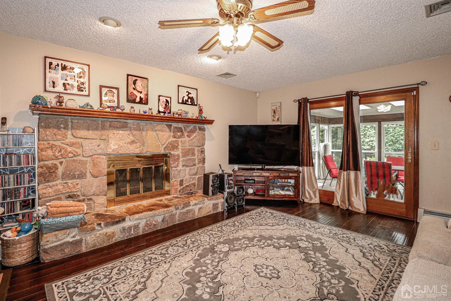 15 Skytop Road Edison, NJ 08820 - Photo 4 of 29 a living room with furniture and a flat screen tv