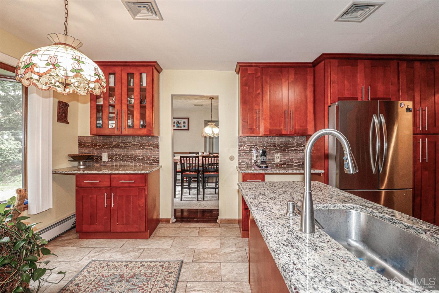 15 Skytop Road Edison, NJ 08820 - Photo 9 of 29 a kitchen with stainless steel appliances granite countertop a refrigerator oven and a sink