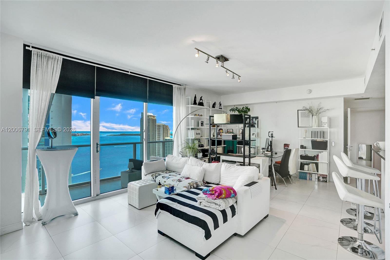 300 South Biscayne Boulevard, Unit T3216 Miami, FL 33131 - Photo 2 of 11 a living room with furniture and white walls
