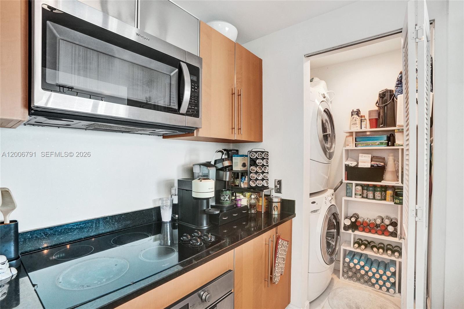 300 South Biscayne Boulevard, Unit T3216 Miami, FL 33131 - Photo 4 of 11 a kitchen with a sink and cabinets