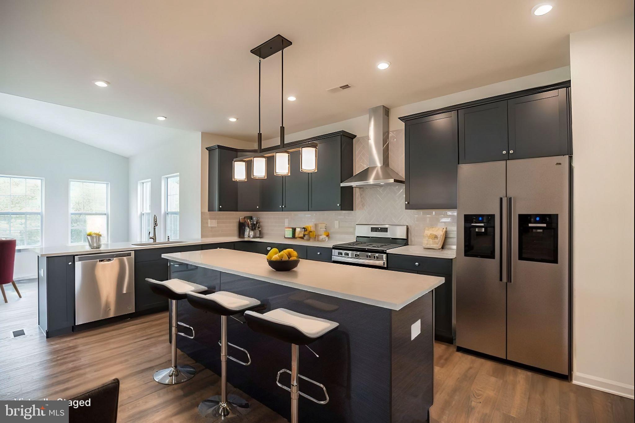 180 Locktown Sergeantsville Road Stockton, NJ 08559 - Photo 14 of 27 a kitchen with stainless steel appliances granite countertop a sink a stove a refrigerator and island
