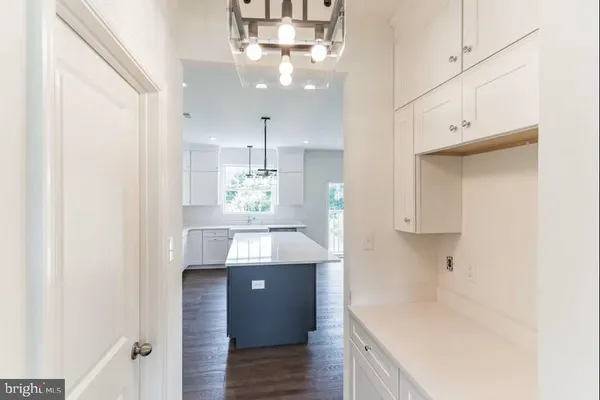 a view of cabinets and wooden floor