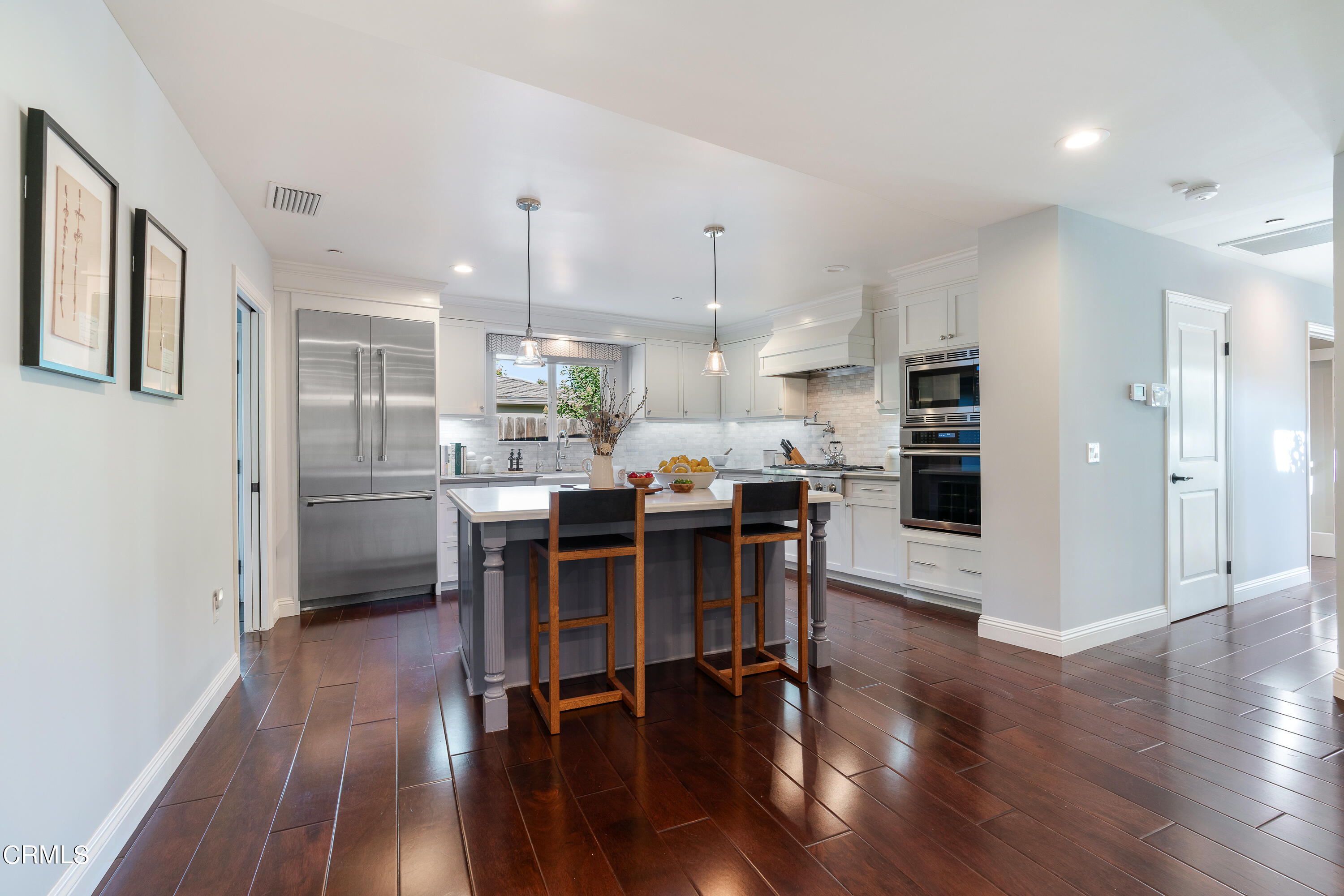 3760 Hampton Road Pasadena, CA 91107 - Photo 6 of 22 a kitchen with a dining table chairs refrigerator and cabinets