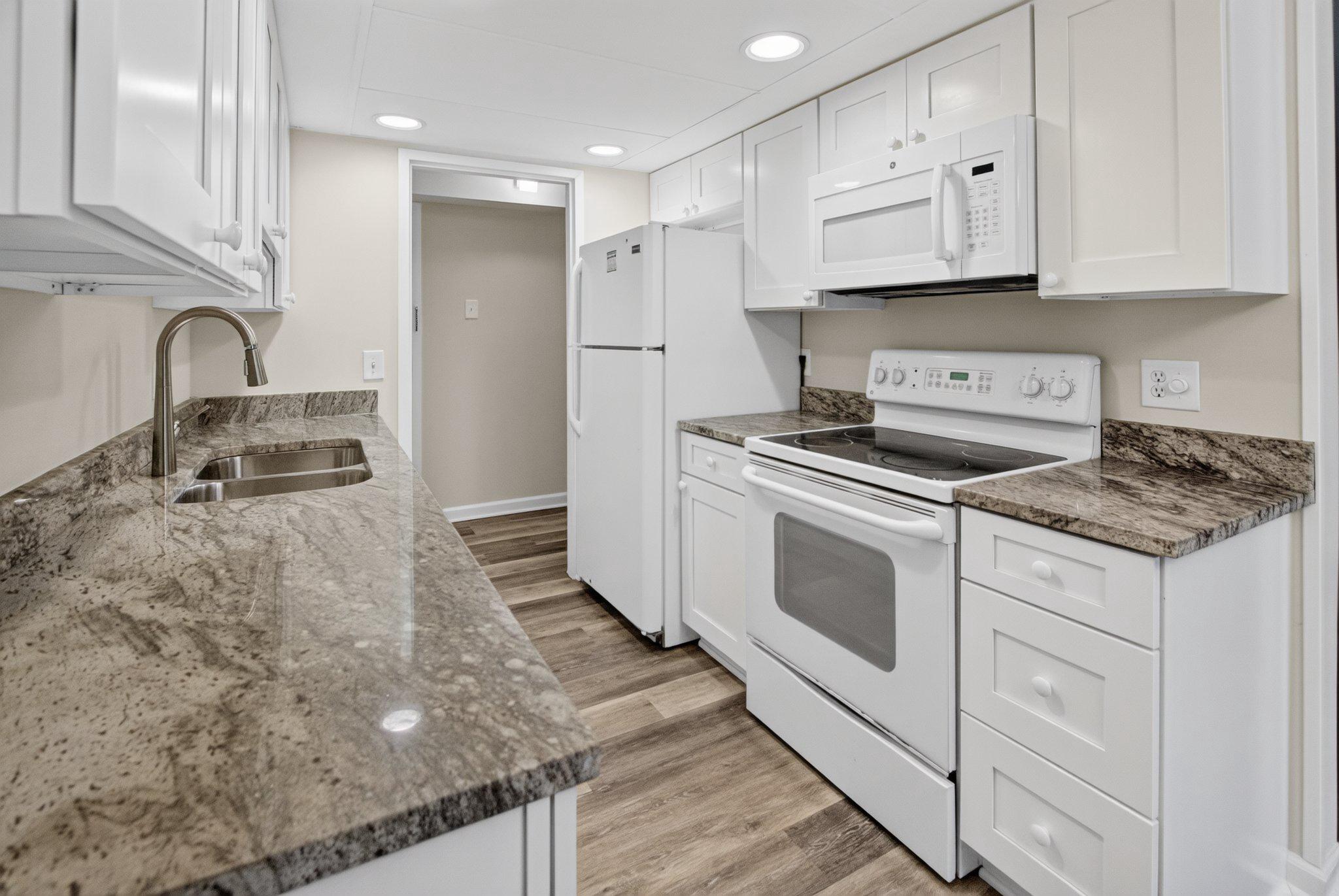 11617 Stoneview Square, Unit 1B Reston, VA 20191 - Photo 4 of 18 Modern kitchen with sleek finishes. View 3 of 4.