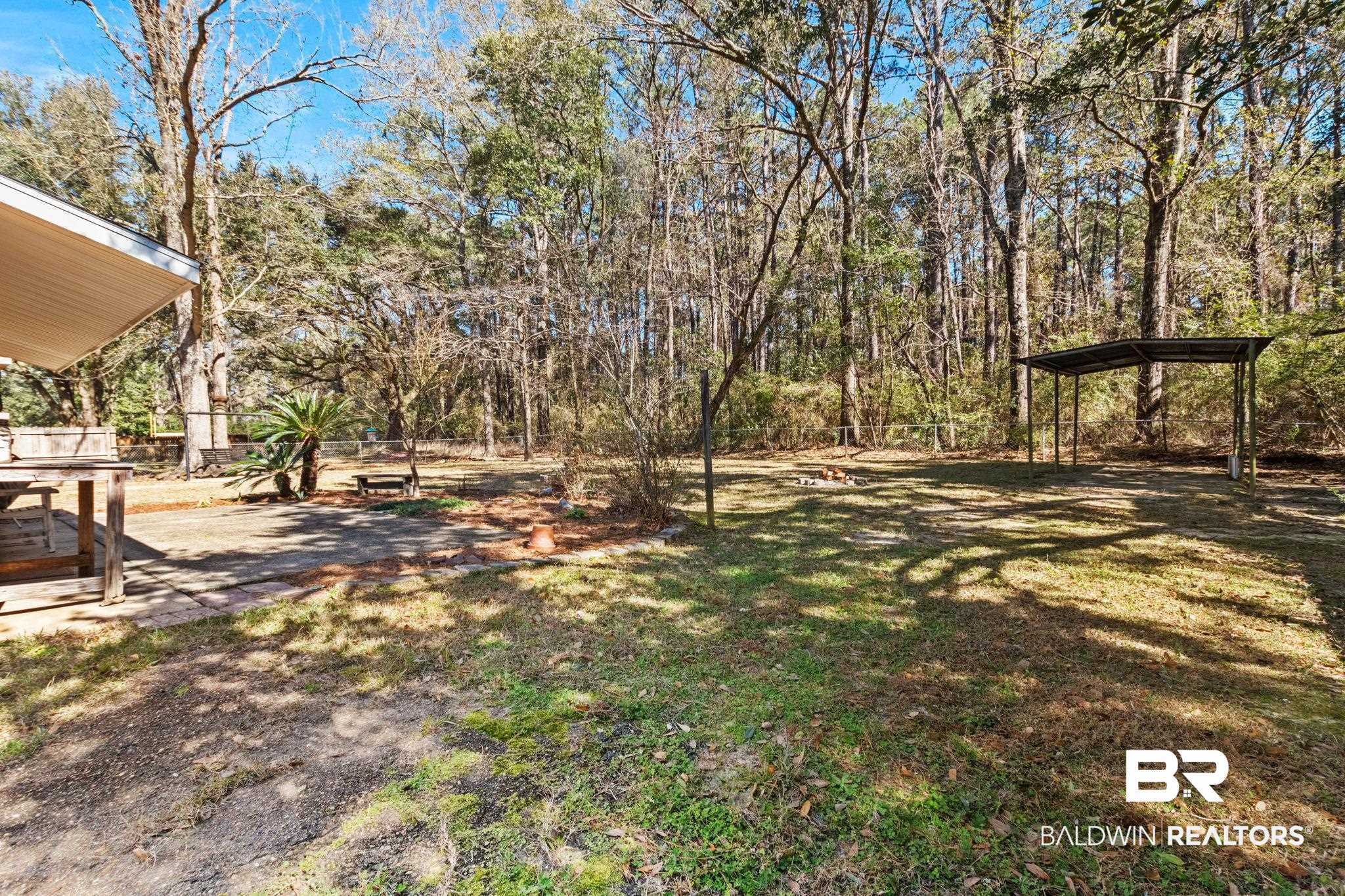 5366 Scanlan Way West Satsuma, AL 36572 - Photo 38 of 43 View of yard featuring a detached carport and a patio