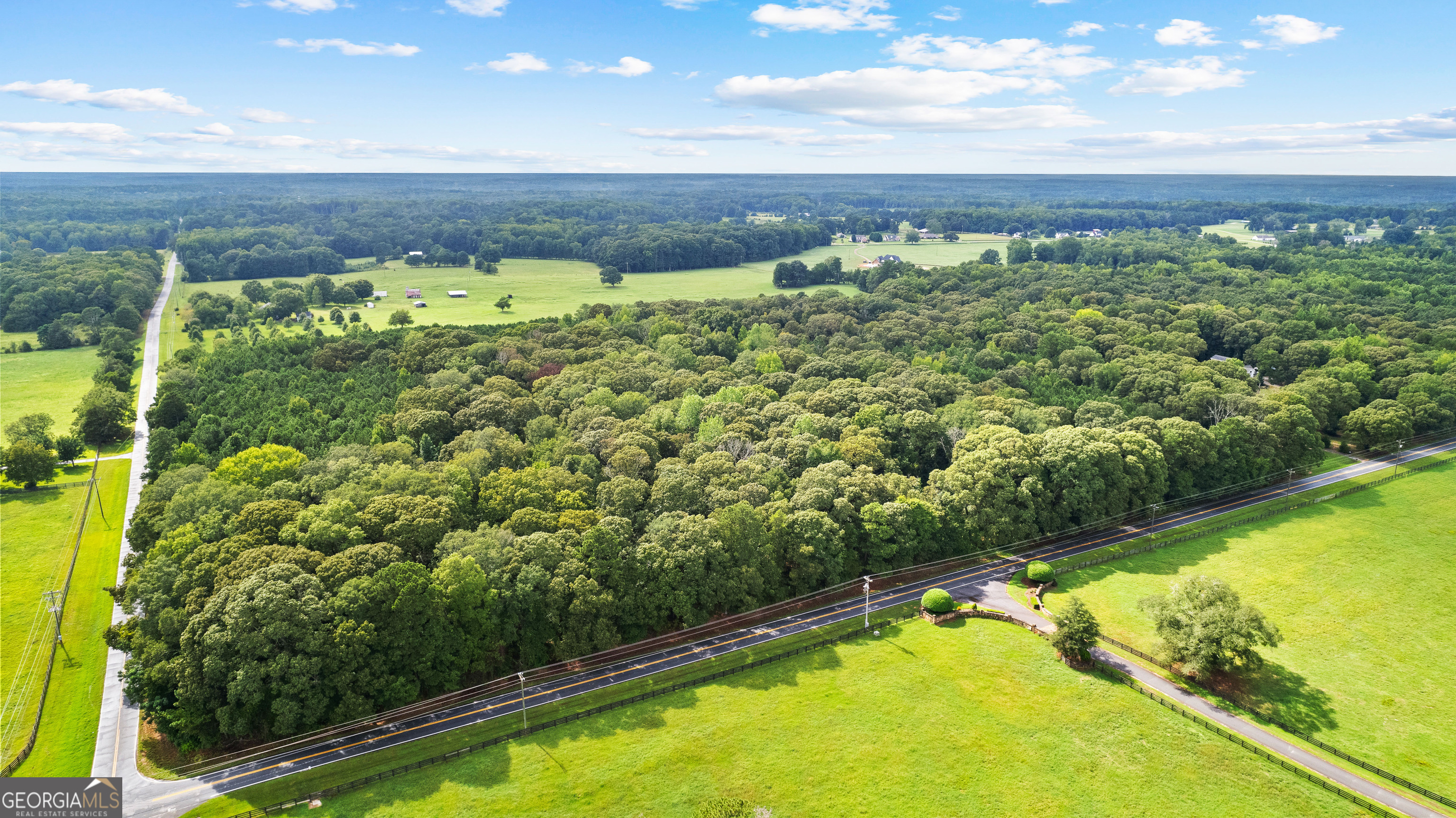 a view of a swimming pool with a yard and outdoor seating