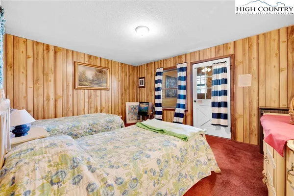 a white toilet sitting next to a bath tub