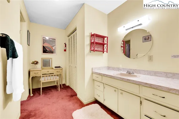 a living room with furniture wooden floor and a chandelier
