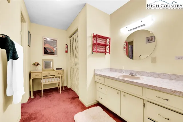 a living room with furniture wooden floor and a chandelier