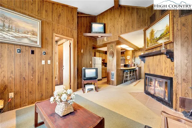 a kitchen with a refrigerator and a sink